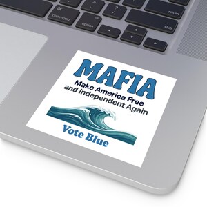 May include: A square white sticker featuring the blue text MAFIA, followed by the black text Make America Free and Independent Again. Below this is a graphic of a teal and blue ocean wave, with the blue text Vote Blue at the bottom.