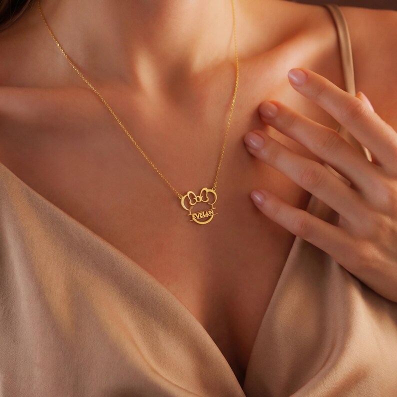 Sparkle with the magic of Disney! Our adorable dainty minnie necklace for kids is a dream come true for your little fan. This personalized cartoon necklace combines the timeless charm of Mickey or Minnie Mouse with your child's very own name, creating a one-of-a-kind keepsake they will treasure on their next Disneyland trip and beyond.