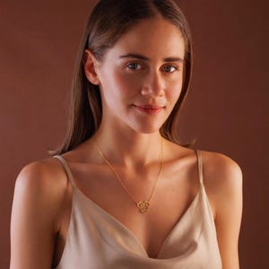 Sparkle with the magic of Disney! Our adorable dainty minnie necklace for kids is a dream come true for your little fan. This personalized cartoon necklace combines the timeless charm of Mickey or Minnie Mouse with your child's very own name, creating a one-of-a-kind keepsake they will treasure on their next Disneyland trip and beyond.