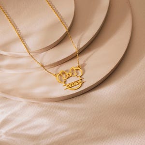Sparkle with the magic of Disney! Our adorable dainty minnie necklace for kids is a dream come true for your little fan. This personalized cartoon necklace combines the timeless charm of Mickey or Minnie Mouse with your child's very own name, creating a one-of-a-kind keepsake they will treasure on their next Disneyland trip and beyond.