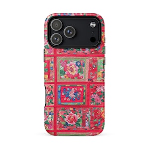 May include: A phone case with a vibrant floral quilt design. The case features a red background with a patchwork pattern of squares, each showcasing a different floral arrangement in shades of pink, blue, and green.