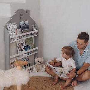 Wooden nursery book storage, Wall-mounted bookshelf for kids room, House-shaped book organizer, Space-saving nursery bookcase