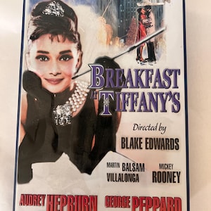 Breakfast at Tiffany&#39;s Collectable Tin, staring Audrey Hepburn, EMPTY container, Size 10” X 7”.