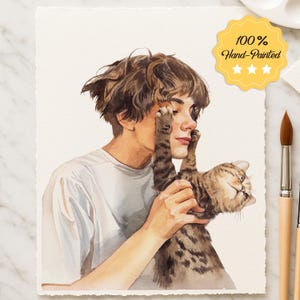 May include: Watercolor painting of a person with brown hair and a white t-shirt, holding a tabby cat. The cat's paws are touching the person's face. A yellow sticker with the text "100% Hand-Painted" is in the upper right corner.