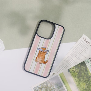 May include: A phone case with a black border featuring a watercolor illustration of an orange tabby cat wearing glasses and holding two fish. The background has pink and green vertical stripes.