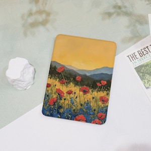 May include: A rectangular case featuring a vibrant painting of a poppy field under a yellow sky. Red poppies and blue wildflowers fill the foreground, with rolling hills in the background. The case is likely for a tablet or e-reader.