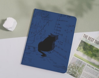 May include: A rectangular notebook with a dark blue cover featuring a black silhouette of a cat sitting in front of mathematical equations and graphs printed in a darker shade of blue across the entire surface of the front cover.