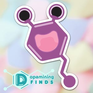 May include: Purple and pink cartoon sticker of a dopamine molecule with two black eyes and a smiling mouth. The sticker has a white outline and is on a pastel background.