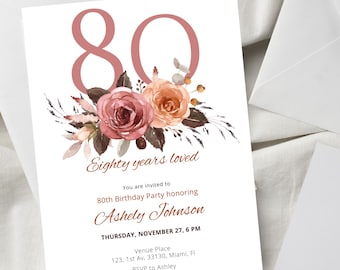 May include: White invitation card with a large, dusty rose number 80 and floral arrangement. The text reads "Eighty years loved" and invites guests to Ashely Johnson's 80th birthday party on November 27th.