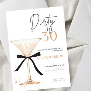 May include: A white invitation card with the words "Dirty 30" in black and gold script. A martini glass with a black bow is featured. The invitation includes party details and RSVP information.