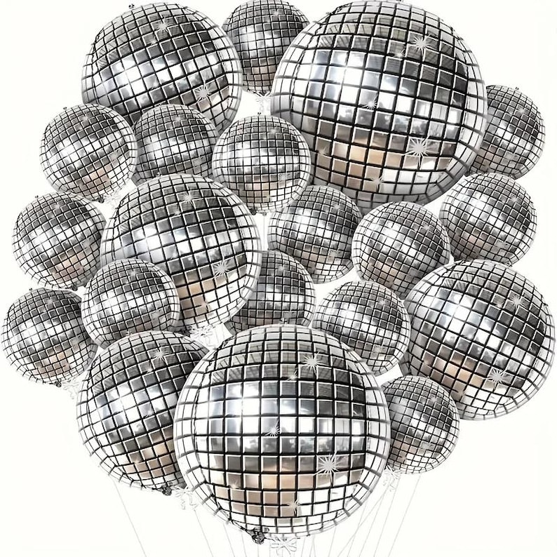 May include: A cluster of silver disco ball balloons, each with a mirrored surface composed of small square tiles. The balloons vary in size and are suspended by thin, clear strings against a white background. These party decorations are ideal for a festive event.