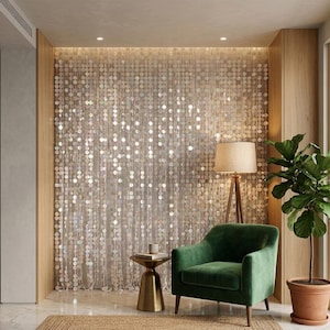 May include: A shimmering wall backdrop composed of numerous translucent, circular sequins hanging in vertical strands. The sequins reflect light, creating a multi-faceted, iridescent effect across the entire surface of the wall covering.