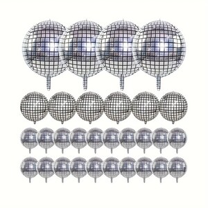 May include: A collection of silver disco ball balloons. The balloons are round with a grid pattern, resembling a classic disco ball. The balloons are arranged in rows, perfect for party decorations.