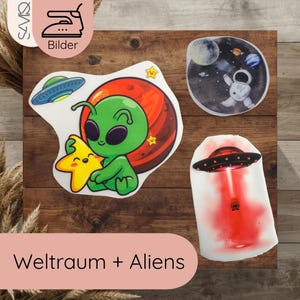 Könnte beinhalten: Eine Sammlung bunter Weltraum-Bügelbilder. Designs umfassen einen grünen Alien, der einen gelben Stern hält, einen Astronauten im Weltraum und eine rote und schwarze UFO. Die Aufnäher befinden sich auf einer Holzoberfläche.