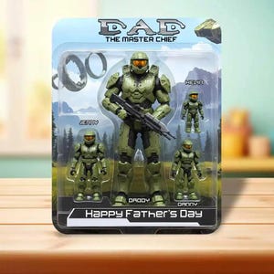 May include: A packaged toy set featuring a large green action figure labeled "DAD THE MASTER CHIEF" holding a rifle, with three smaller figures. The package reads "Happy Father's Day". The figures are in a clear plastic case.
