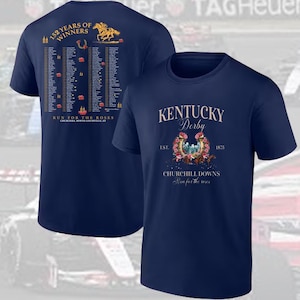May include: Navy blue t-shirts with graphics related to the Kentucky Derby. One shirt features text and a list of winners, the other displays "Kentucky Derby" with floral and horseshoe imagery. The shirts are for the Churchill Downs race.