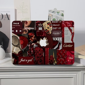 May include: A laptop skin featuring a red-themed collage of luxury brand logos, fashion imagery, and text including "WANT IT I deserve it GET IT," "Just a girl," "Chanel," "Cartier," "Dior," "Hermes," and a Porsche emblem, centered around a white Apple logo.