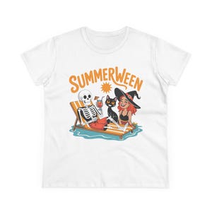 May include: White t-shirt with the word "SUMMERWEEN" in orange above a cartoon illustration. The illustration depicts a skeleton in red shorts, a black cat, and a woman in a witch hat relaxing on a beach chair.