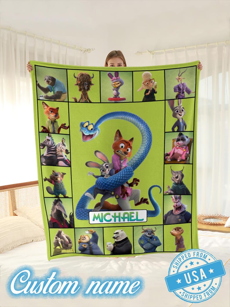May include: A green fleece blanket featuring characters from the animated movie Zootopia. The blanket has a grid design with various characters, a large blue snake, and the name "MICHAEL" in a white box. The words "Custom name" are also visible.