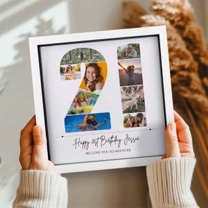 May include: A square white framed photo collage featuring multiple images arranged to form the number 21. The text below the collage reads Happy 21st Birthday Jessie WE LOVE YOU SO MUCH XX. The design is printed on a white background.