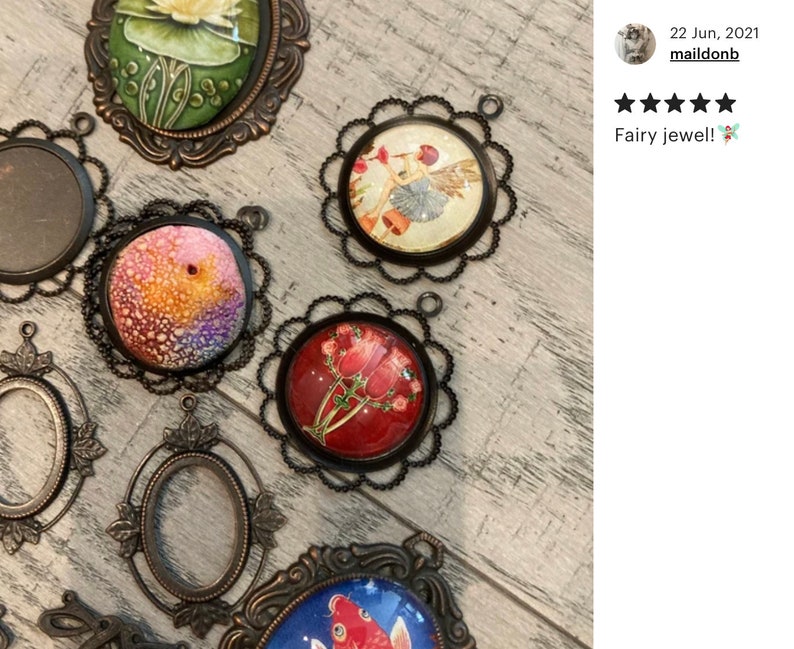 May include: Assortment of vintage-style metal frames with glass inserts. Some frames feature colorful images of a fairy, flowers, and a fish. The frames are perfect for crafting and jewelry making.