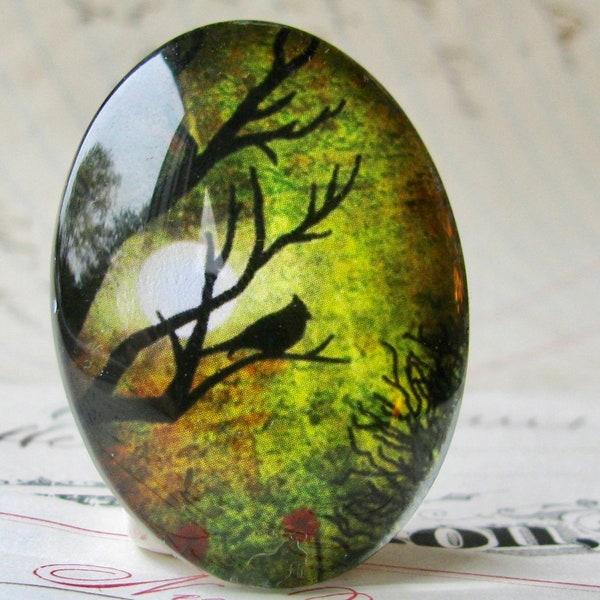 Bird in a tree silhouette against full moon, 40x30mm handmade glass oval cabochon, olive green sky, sunset, mystical moon