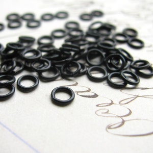Tiny 4mm jump ring black antiqued brass (50 rings) aged oxidized patina, 24 gauge, made in the USA, small open jump rings