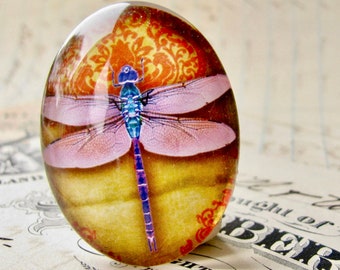 Pink dragonfly cabochon, handmade glass oval cabochon, 40x30mm or 25x18mm, orange wallpaper background, winged, wings