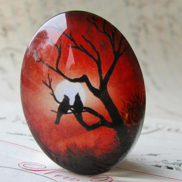 Lovebirds in a tree silhouette against a full moon, 40x30mm handmade glass oval cabochon, red sky, sunset, Mystic Moon