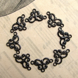 Teeny tiny flourish link, 13mm, black brass (8)