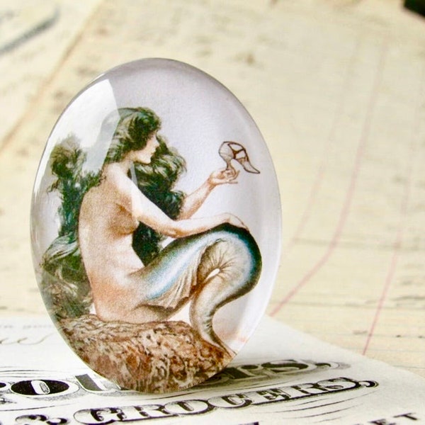 From 1921, mermaid holding a shoe, wishing for legs, long black hair, handmade glass oval cabochon, 25x18 or 40x30mm, magical