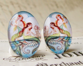 Mirrored pair of mermaids riding on a seahorse, two handmade glass oval cabochons, opposites for earrings, 25x18mm, art cabochon