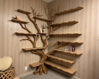 May include: A unique, handcrafted wooden tree bookshelf. The bookshelf is designed to look like a tree with multiple shelves of varying sizes. The tree is a warm brown color, and the shelves are a lighter shade of brown. A decorative piece for any room.