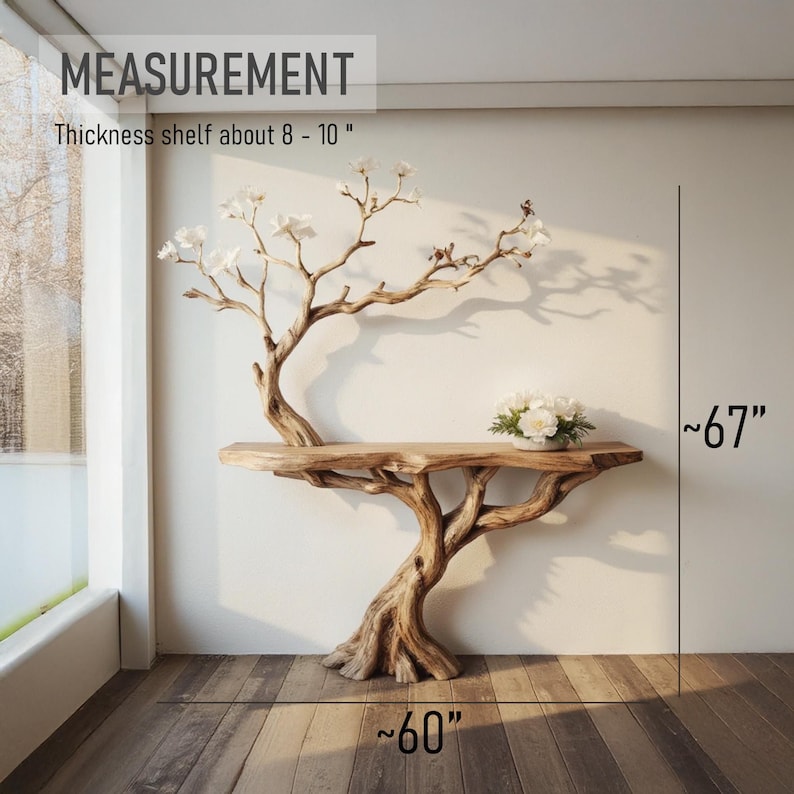 Puede incluir: Una consola de madera con forma de &aacute;rbol con un estante de aproximadamente 8 a 10 pulgadas de grosor. La mesa tiene 60 pulgadas de ancho y 67 pulgadas de alto. La mesa tiene un acabado de madera natural y est&aacute; decorada con un peque&ntilde;o ramo de flores blancas.