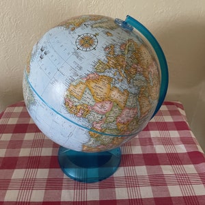 Globemaster 12 inch diameter Globe with blue plastic base.