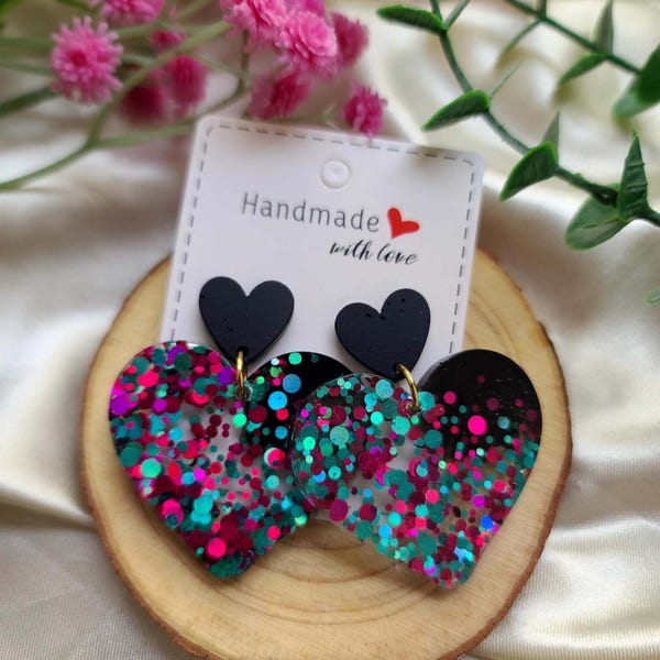 Resin earrings with black and multicoloured glitter hearts