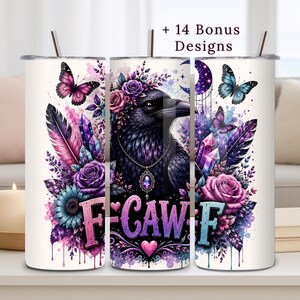May include: A cylindrical tumbler featuring a black raven adorned with a floral crown and a jeweled necklace, surrounded by purple and pink roses, crystals, feathers, and butterflies. The text F-CAW-F is displayed in a stylized gradient font.