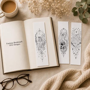 May include: Three rectangular white bookmarks featuring black line art illustrations. One bookmark shows a fairy with a rose, another a dragon perched on books, and the third a mountain landscape with a crescent moon. The text reads Fantasy Bookmark SVG Designs.