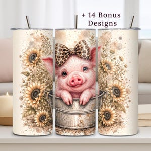 May include: A set of three stainless steel insulated tumblers. The center tumbler features a watercolor illustration of a pig wearing a bow, inside a metal bucket, surrounded by sunflowers. The text "+ 14 Bonus Designs" is at the top.