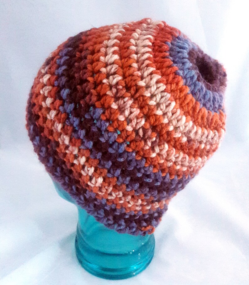 chunky yarn multi-color warm tones Messy Bun hat in Fall colors   Top Knot Beanie with stretch Ready to ship