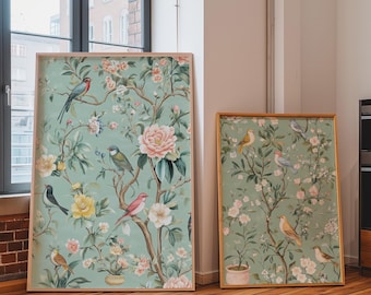 May include: Two framed botanical art prints featuring birds and floral designs. The larger print showcases a variety of birds amidst blooming flowers in shades of pink, yellow, and green. The smaller print has a similar design.