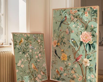 May include: Two framed prints with a green background and floral designs. The prints feature various birds and flowers in shades of pink, yellow, and blue.