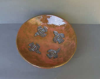 Large Stoneware Bowl Glazed in Glossy Copper, with Embossed Aztec Bird Designs in Gold