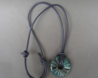 Stoneware Disc Pendant, Glazed in Mottled Blue with a Glossy Finish, on a Round Leather Cord in Dark Purple