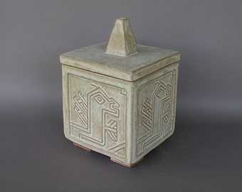 Lidded stoneware jar (or pet urn) with 15th century Middle Eastern tribal rug design