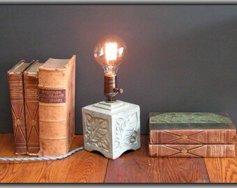 Stoneware lamp with vintage-style Edison bulb, and Arts & Crafts design of leaves, in light blue