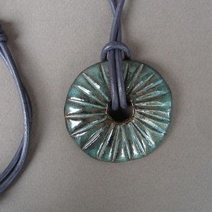 Stoneware Disc Pendant in Glossy Mottled Blue, on a Round Leather Cord in Dark Purple image 1