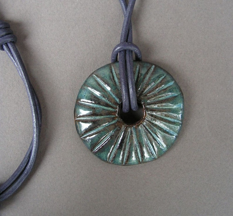 Stoneware Disc Pendant in Glossy Mottled Blue, on a Round Leather Cord in Dark Purple image 1