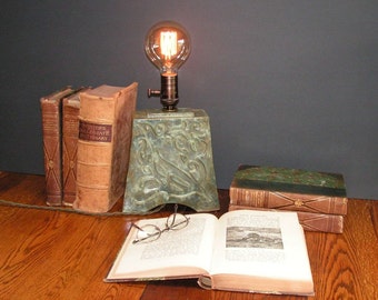 Stoneware lamp with vintage "Edison" bulb, and indented Art Nouveau design of a bird, mottled green glaze