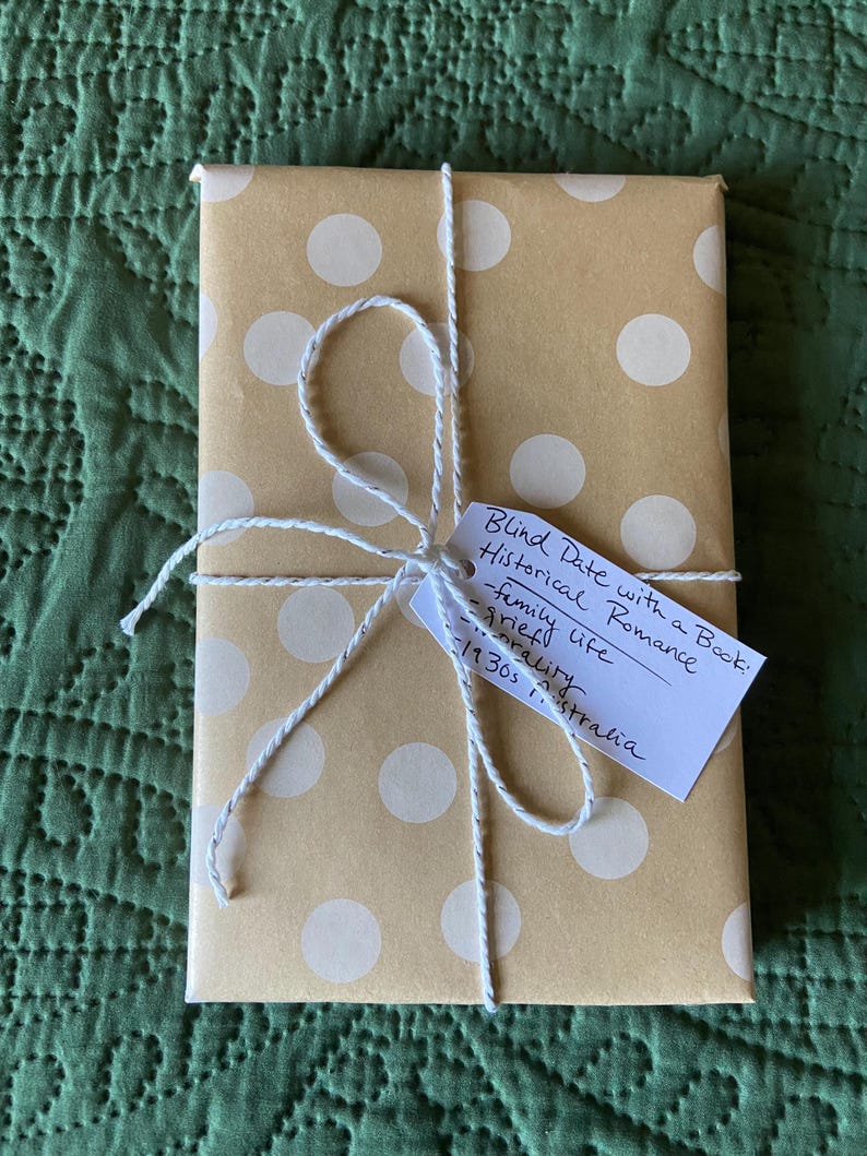 This image shows an exemplar of a book wrapped in brown polka dot wrapping paper in the genre historical romance.